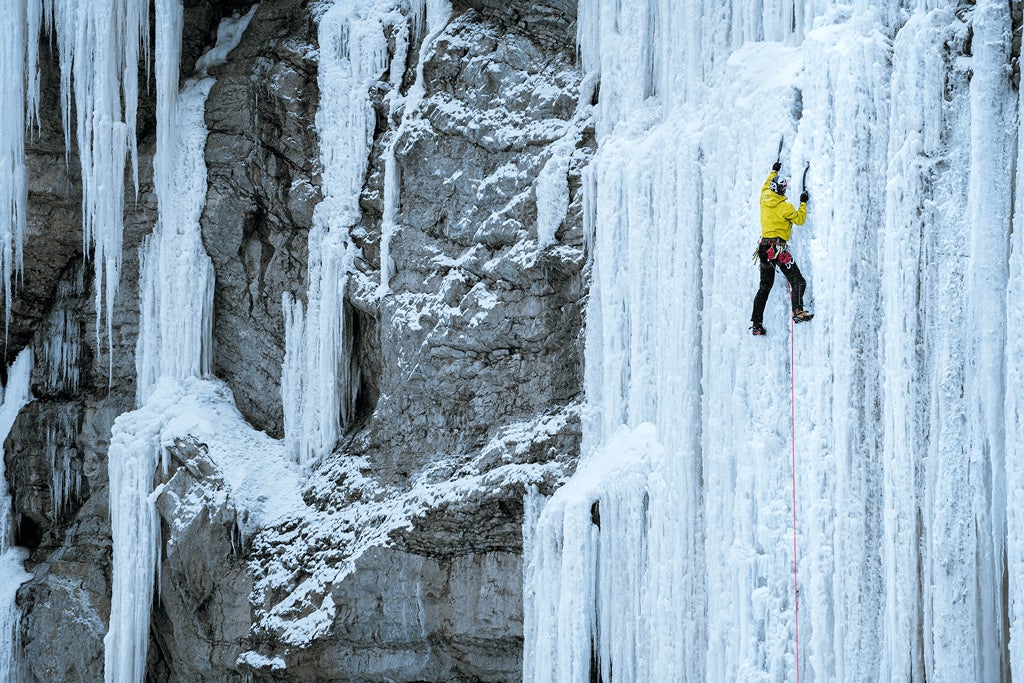 Ice climber on the side of a mountain